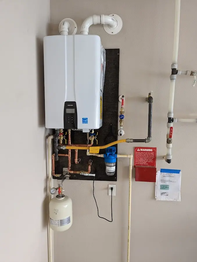 Professional plumber installing copper piping in a Wesley Chapel home